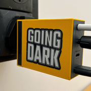 A iphone charger featuring the Going Dark Special Edition 7-Piece Sticker Set. The set includes a variety of unique finishes, featuring holographic, mirror, and glitter designs that catch the light in all the right ways, creating a dynamic, eye-catching effect. The stickers are displayed on the lid of the, with bold, edgy graphics, including abstract patterns, logos, and stylised text, adding a custom, artistic flair