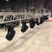Magnetic Mini Spirit Level placed on truss-mounted moving light for accurate leveling.