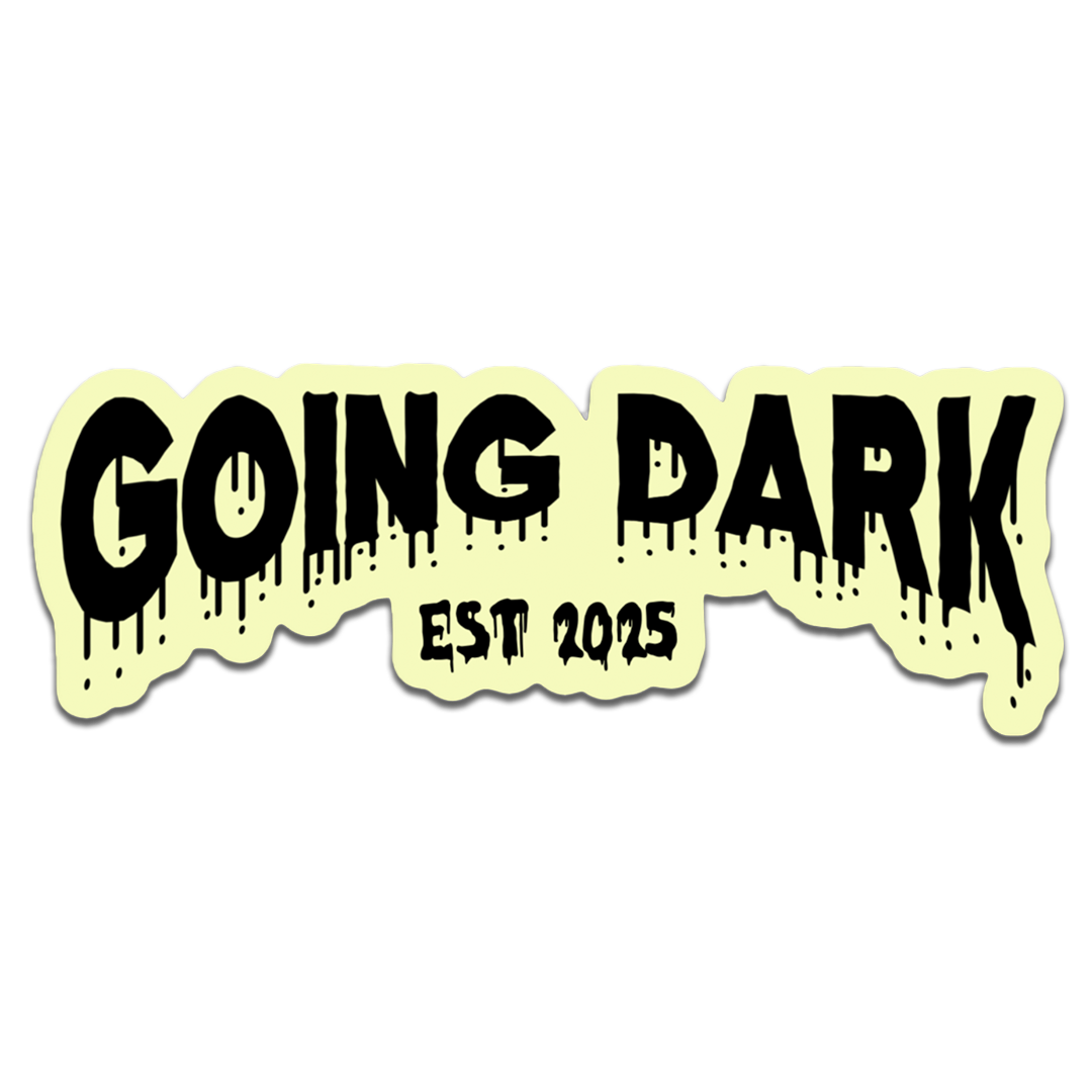 Sticker with 'GOING DARK EST 2025' text on a light yellow background