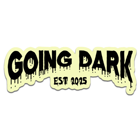 Sticker with 'GOING DARK EST 2025' text on a light yellow background